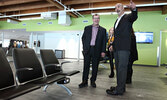 Airport Manager Ben Hancharuk (right , pointing) takes Kenora MP Bob Nault on a tour of the terminal building. Powered seats ( beside Nault) are just one of the many upgrades at the terminal building. - Tim Brody / Bulletin Photo