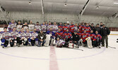 Local police officers (left group) and members of the Sioux Lookout Fire Service (right group) faced off in a charity hockey match on Feb. 18.    Tim Brody / Bulletin Photo