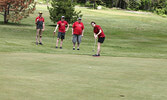 Shannon Joblin tries to sink a putt on hole 4. - Tim Brody / Bulletin Photo