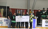 $4000 was raised at the game and donated to the Sioux Lookout Meno Ya Win Health Centre Foundation for mental health initiatives.  From left: Bombers President Joe Cassidy, SLFNHA CEO and President Sonia Isaac-Mann, SLFNHA Board Chair Howard Meshake, SLMH
