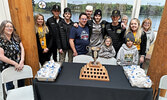 Members of the SIJHL champion Sioux Lookout Bombers pose for a photo with fans at the Sioux Lookout Meno Ya Win Health Centre’s main entrance.   Tim Brody / Bulletin Photo