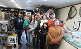 Wayne and Karla Clark are surrounded by members of their family and staff at the grand opening of their new store, Clark’s Bait and Tackle and Village Trading Post.  From left: David Lalonde – staff member, Kassandra Dinsmore – staff member, daughter Meag