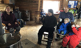 Visitors to the Cozy Cabin warmed themselves by the fire and enjoyed hot chocolate and tea. - Tim Brody / Bulletin Photo