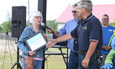 A snapshot from 2022 - Rotary Club of Sioux Lookout President Kirk Drew (right) and fellow Rotarian Dick MacKenzie (centre), Master of Ceremonies for the Blueberry Festival’s opening ceremonies, congratulate Cathy Morriss (left), recipient of the 2022 Jac