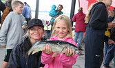 Karla Madsen and daughter Sailor Atwood show off their big fish, which weighed in at 2.96 pounds and was caught by Sailor.    Tim Brody / Bulletin Photo