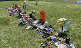 The memorial, at the corner of Wellington Street and Government Row, has been growing as visitors pay their respects, many leaving shoes as a visualization of the 215 children lost.     Tim Brody / Bulletin Photo