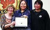Lorraine Kenny (centre) receives a certificate of lifetime membership with the Sioux Lookout Anti-Racism  Committee on March 27, 2009 from fellow lifetime SLARC member Terry Lynne Jewell (left) and SLARC board member at the time, Anna McKay. - Bulletin Fi