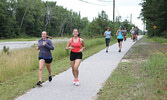 Event participants run along the Umfreville Trail.    Tim Brody / Bulletin Photo