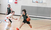 The Sioux North High School Senior Boys Basketball Team (the Warriors) in action against the visiting Westgate Collegiate and Vocational Institute Senior Boys Basketball Team (the Tigers) in game two of the NWOSSA “AA” Basketball Championship.  Tim Brody 