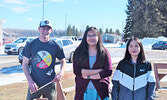 From left: Mitch Simmons (PFFNHS staff member), Joanna Quequish (grade 10 student), and Penelope Roundhead (Grade 12 student) worked tirelessly to keep the sacred fire lit just outside of PFFNHS. - Jesse Bonello / Bulletin Photo