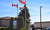 Mayor Doug Lawrance and Mary-Ann Flatt raise the Pride flag at the Sioux Lookout municipal office, where it will remain waving for the rest of the month. - Jesse Bonello / Bulletin Photo