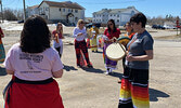 Participants in a Red Dress Day event, hosted on May 5 by Sunset Women’s Aboriginal Circle, take part in a round dance.   Tim Brody / Bulletin Photo