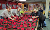  Volunteers in Sioux Lookout put together this year’s Remembrance Day poppy displays.   Photo courtesy of Dorothy Broderick