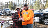 Organizer BJ Egerter (right) congratulates Joseph Bernier on taking first prize in the Annual Debbie Hill Memorial Ice Fishing Derby, hosted by the Sioux Lookout Anglers and Hunters.   Tim Brody / Bulletin Photo
