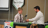 Gabe Otto (left) receives his Cross Country Most Dedicated Runner award. - Jesse Bonello / Bulletin Photos