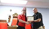 Jeremy Funk (right) accepts a certificate of appreciation from Potentate Denis Lorteau on behalf of C.U.P.E. Local 2141 Municipal Workers of Sioux Lookout.