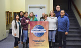 The Siouxper Speakers Toastmasters Club proudly displaying their club banner along with their newly acquired Distinguished Club ribbon. From left: Crystal Harrison, Michelane Gliddy, Anita Bruins-Burke, Kym Caldwell , Stuart Cummings, Deb Austin, Andrea C