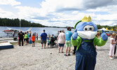 Sioux Lookout Blueberry Festival mascot Blueberry Bert gives a thumbs up to community members and visitors to town physical distancing as they wait for their floatplane ride.  - Tim Brody / Bulletin Photo
