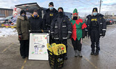 FSWS staff and Sioux Lookout OPP officers collect donations during last year’s Stuff A Cruiser initiative.     Bulletin File Photo