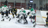 The Warriors battle the Muskies in boys hockey action on Feb. 8.   Tim Brody / Bulletin Photo
