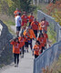Orange Shirt Day walkers make their way to the Travel Information Centre from Frog Rapids Bridge.      Mike Lawrence / Bulletin Photo