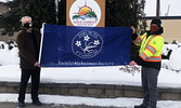 Mayor Doug Lawrance (left) and facilities worker Kyle Briska holding the Alzheimer Society flag.  - Reeti Meenakshi Rohilla / Bulletin Photo
