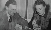 John and Nan examining some of their mineral finds in their hotel room in Prince Albert, Saskatchewan on their way to Toronto.     Prince Albert Daily Herald photo, March 21, 1950