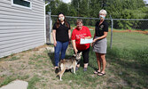 Sioux Lookout Lions Club volunteer Jenn Elwell (left) with Club Secretary Lisa Larsh (right) presenting a $1000 cheque to Sioux Looks Out for Paws Chair Lynda Ducharme (centre).     Reeti Meenakshi Rohilla / Bulletin Photo