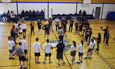 PFFNHS students, among Providence University College athletes and staff, huddle up to receive instructions for their next drill. - Jesse Bonello / Bulletin Photo