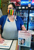 Debora Young stands with her donation jar for the Betty White Challenge at Fair Convenience. All funds raised will go towards the Sioux Looks Out For Paws animal rescue.    Mike Lawrence / Bulletin Photo