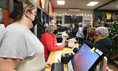 Black Friday shoppers visit participating local retailers as well as a market at the Legion to pick up items for those on their holiday gift lists.      Tim Brody / Bulletin Photo