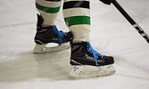 Players from both the boys and the girls hockey teams at Sioux North High School wore blue laces to support mental health awareness. - Jesse Bonello / Bulletin Photo