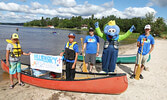From left: Rio Ollis, Caden Culham, Brent Darling, Blueberry Festival mascot Blueberry Bert and Charles Darling prepare to begin the Blueberry Flotilla. - Tim Brody / Bulletin Photos