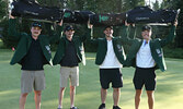 Members of the Philly Flops, adorned in first place green jackets, hoist their new golf bags in celebration after winning the 2022 Bombers Golf Classic. From left: Ty Levesque, Cam Bailey, Ben Forbes, and Kendall Schulz.   Tim Brody / Bulletin Photo