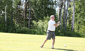 John Cummine tees off.    Tim Brody / Bulletin Photo