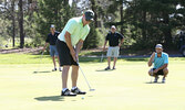 Whitney Van Horne putts in for his team, The Bogeymen.   Tim Brody / Bulletin Photo