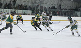 Bombers forward Jonah Smith (far right) looks for an opening in the North Stars’ defense. Smith scored two goals in the Bombers home and season opener.    Tim Brody / Bulletin Photo