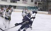 The Bombers and Ice Dogs battle for the puck.   Tim Brody / Bulletin Photo