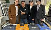  From left: Bombers defenceman Nolan Palmer, Jech Apparel Owner Jeremy Capay, Bombers forward Owen Riffel, and Bombers forward Alex Lucas.  Tim Brody / Bulletin Photo