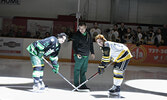 Sioux Lookout First Nations Health Authority Board Chair Howard Meshake drops a ceremonial puck to get last Saturday night’s hockey match highlighting Mental Health Awareness going. Taking the faceoff are Bombers Assistant Captain Dayvan Bull (left) and M