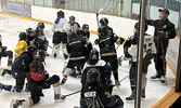 Bombers Head Coach Carson Johnstone (far right) instructs Sioux Lookout Minor Hockey Association players during a recent development camp.   Tim Brody / Bulletin Photo