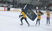 Sioux Lookout Skating Club skaters, along with a member of the Sioux Lookout Minor Hockey Association, get the crowd “Fired Up” during Game 4.    Tim Brody / Bulletin Photo