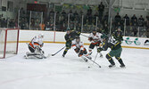 Bombers Forward Cobe Delaney takes a shot on Fighting Walleye Goalie Ashton Sadauskas.    Tim Brody / Bulletin Photo