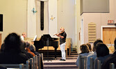 Meritt Penner (right) performing alongside his dad Arden Penner (piano). - Jesse Bonello / Bulletin Photo