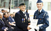 Squadron Commander FSgt. Luke Bates (right) receives The Royal Canadian Legion Cadet Medal of Excellence from reviewing officer Kirk Drew, MMM, CD. - Tim Brody / Bulletin Photo