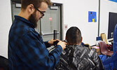 Many students walked out of the career fair with a new haircut and lineup courtesy of Marble Eye Barbery. - Jesse Bonello / Bulletin Photo