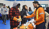 Participants were able to try on a variety of safety gear while at the Hydro One booth. - Jesse Bonello / Bulletin Photo