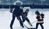 Cliff Comber, Manager of Materials, Eastern Canada at Westjet,  faces off against his two sons on the ice. It was a desire to donate his boys’ used hockey gear to a northern community that snowballed into the donation of 25 bags of used hockey gear for Ca