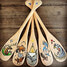 Chelsea Greig - Painting of five northern communities’ logos on paddles.