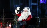 Santa Claus waves to the crowd during the 2019 parade.     Bulletin File Photo